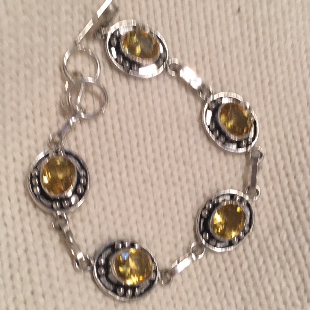 Here Sterling Silver and faceted citrine.